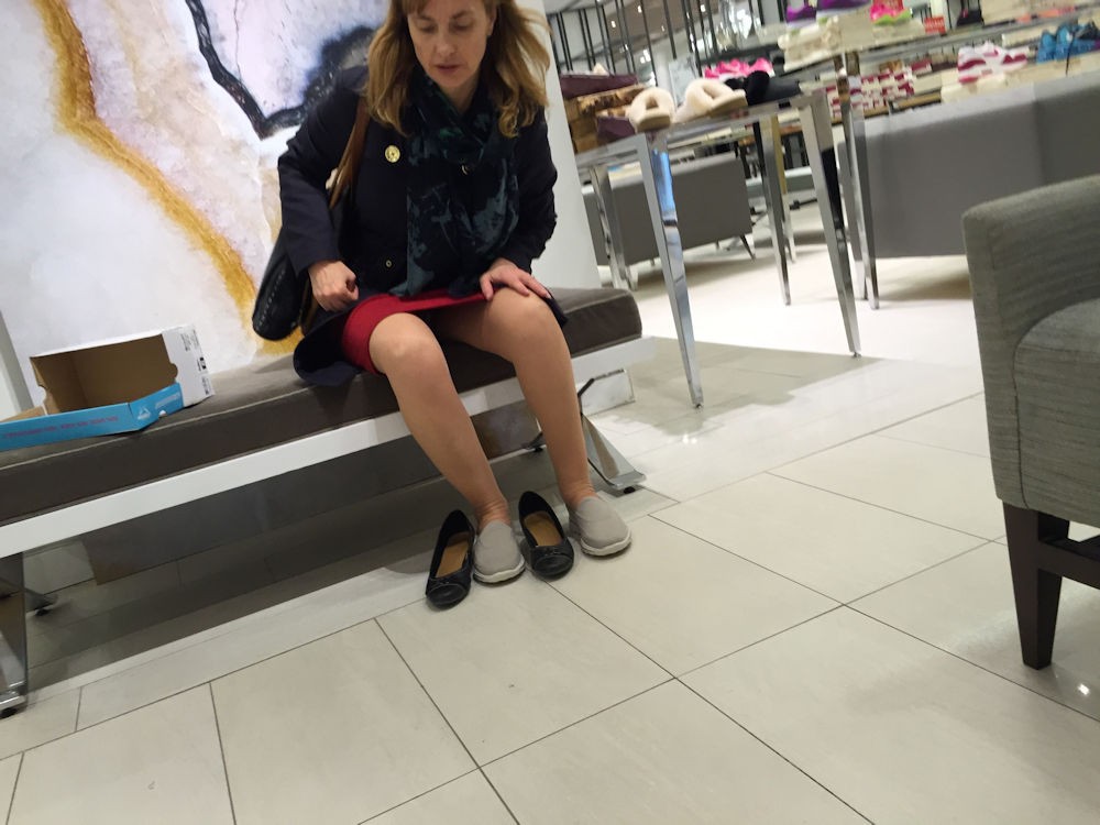 Candid shoeplay airport employee from behind